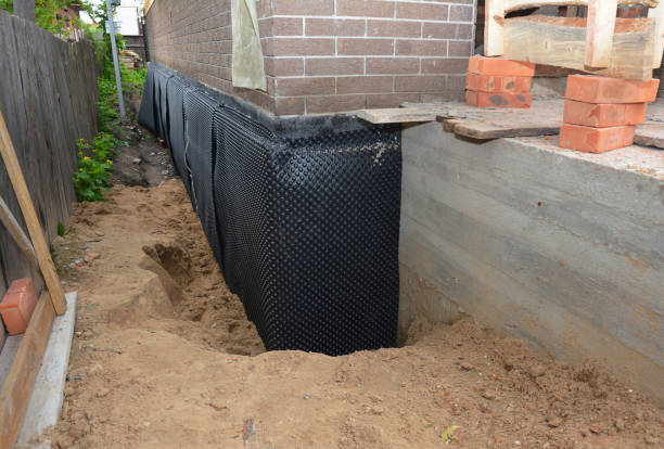 Happy homeowners after waterproofing job in Jackson